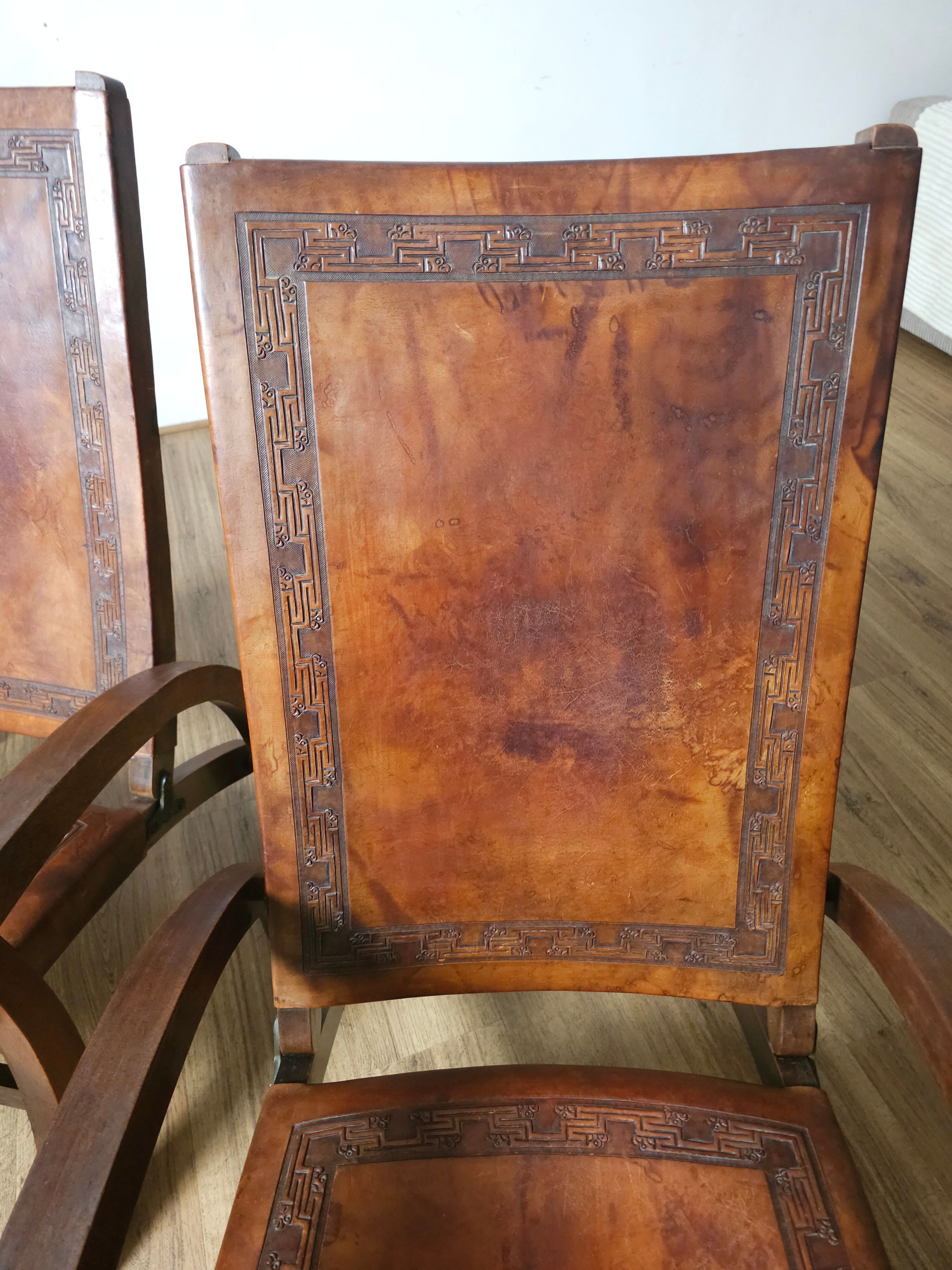 Leather and teak armchairs, by Angel Pazmino, circa 1960.