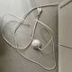Modernist wall lamp with white metal shade, design by C. Grandidier.