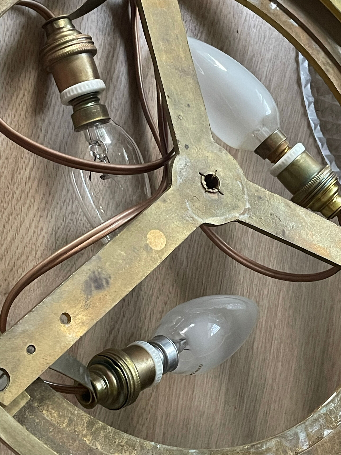 Antique ceiling light in bronze and cut crystal with diamond points.