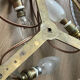 Antique ceiling light in bronze and cut crystal with diamond points.