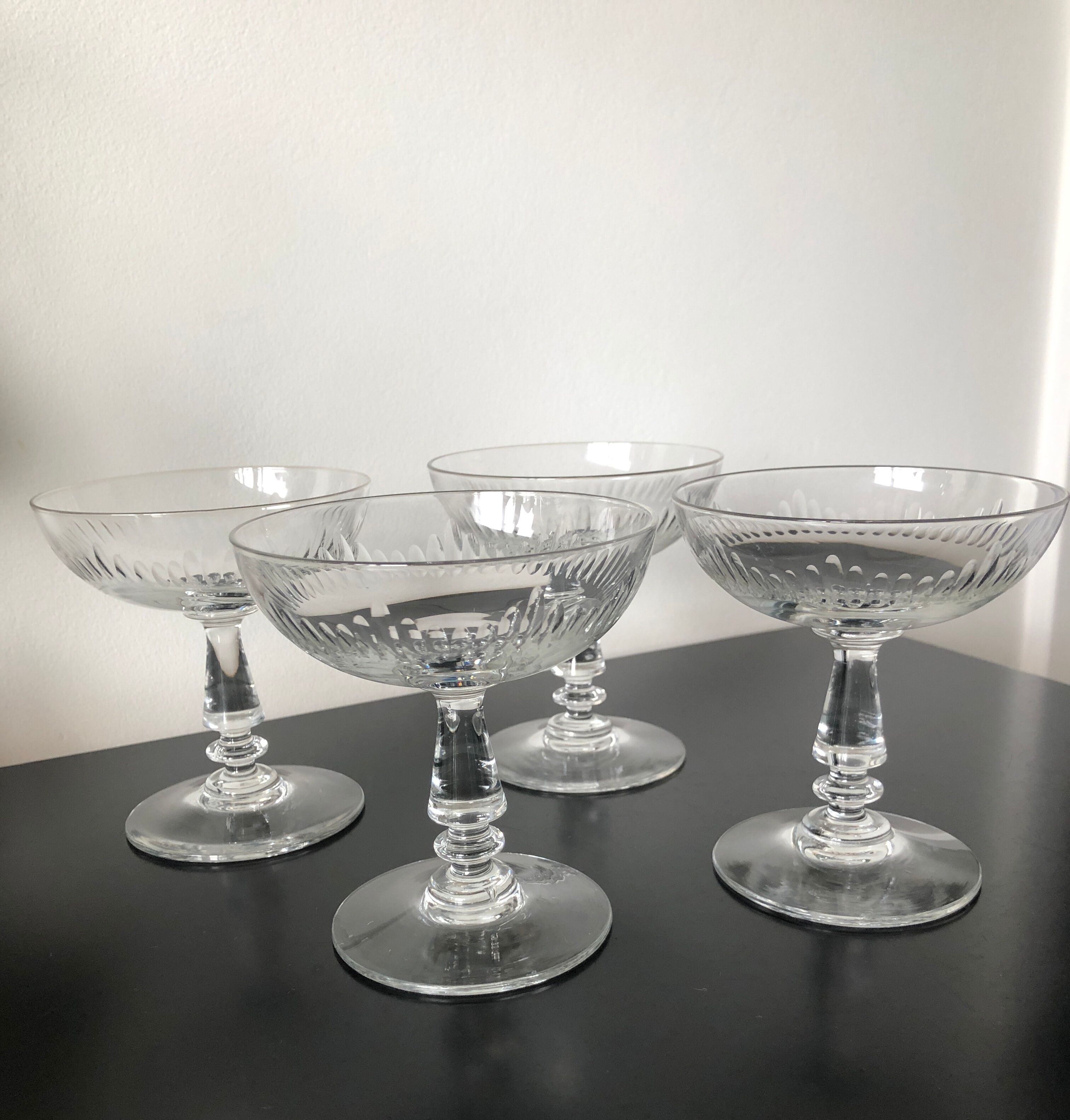 4 glasses of carved crystal champagne