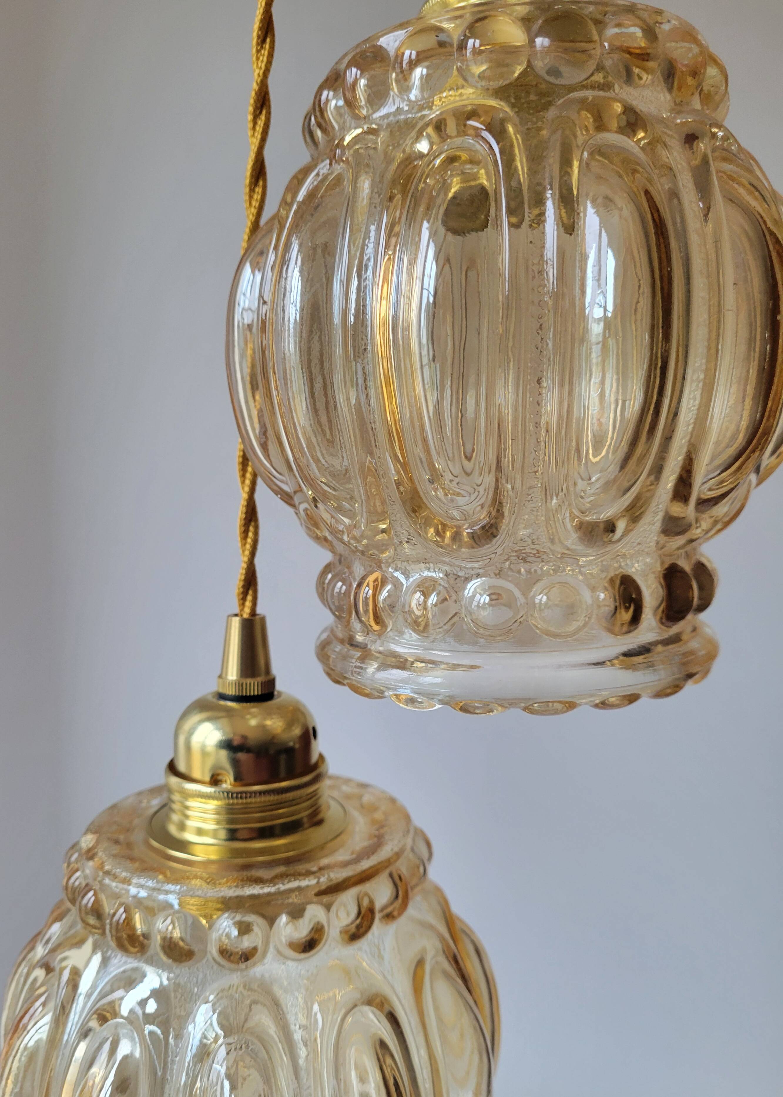 Duo of molded glass pendant lights