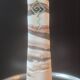 Turned stoneware vase signed with relief decoration.