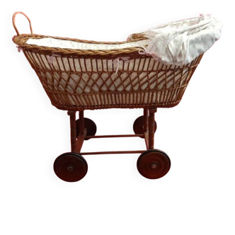 Vintage 1970s wicker cradle on wheels