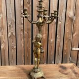 Large bronze candle holder with putti angel