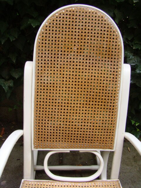 Antique caned rocking chair