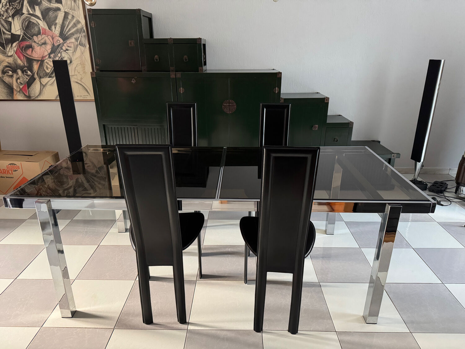 Vintage Roche Bobois dining table with smoked glass and 4 leather chairs.
