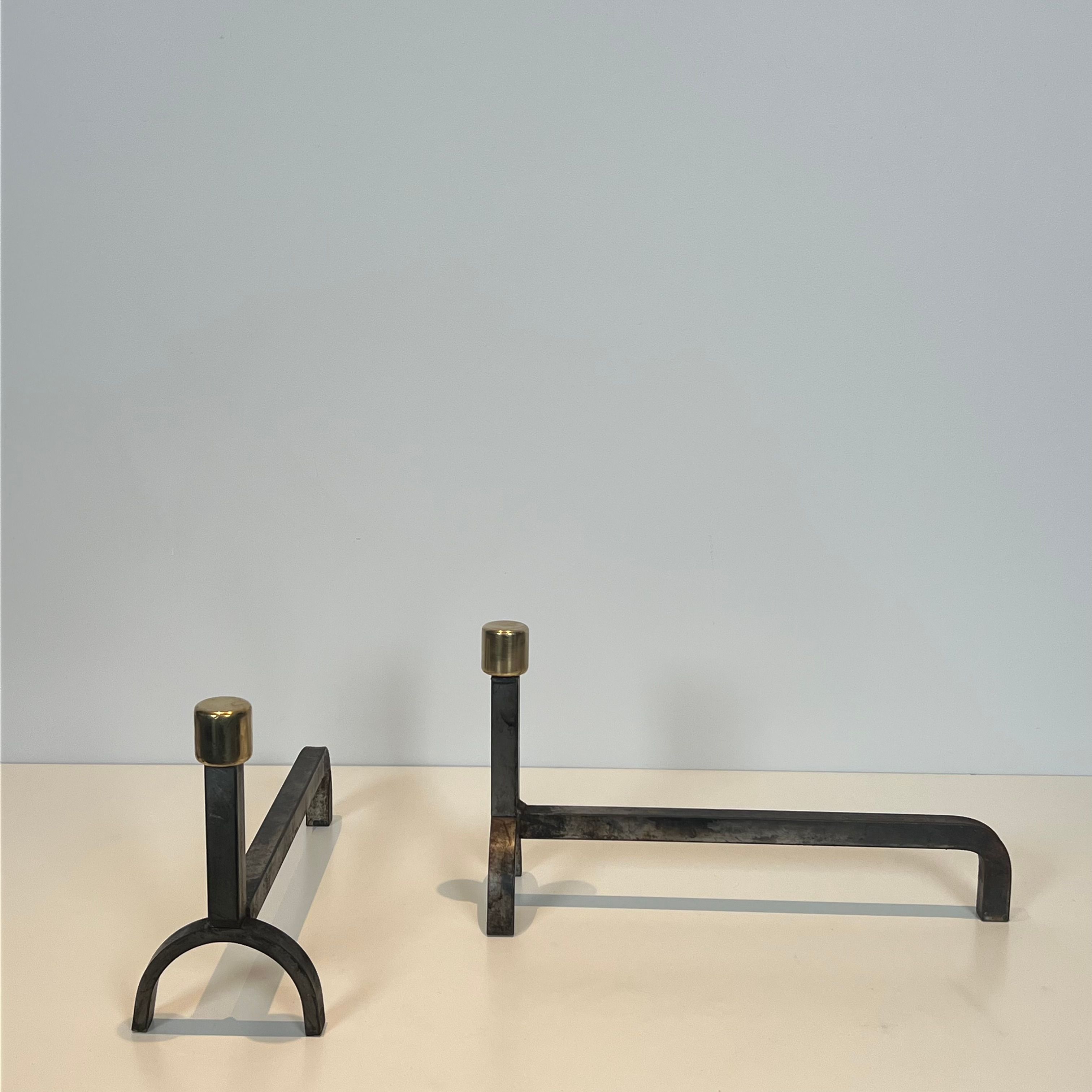 Pair of modernist fire dogs in wrought iron and brass