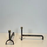 Pair of modernist fire dogs in wrought iron and brass