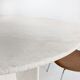 Round dining table in travertine from the 1980s.