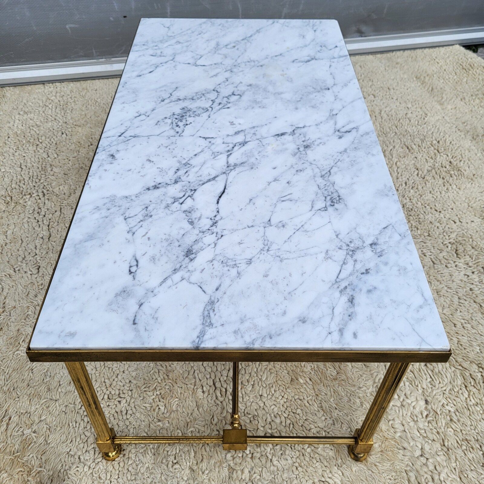 Hollywood Regency style coffee table • marble and brass