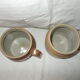 Set of 2 small stoneware pots with handle.