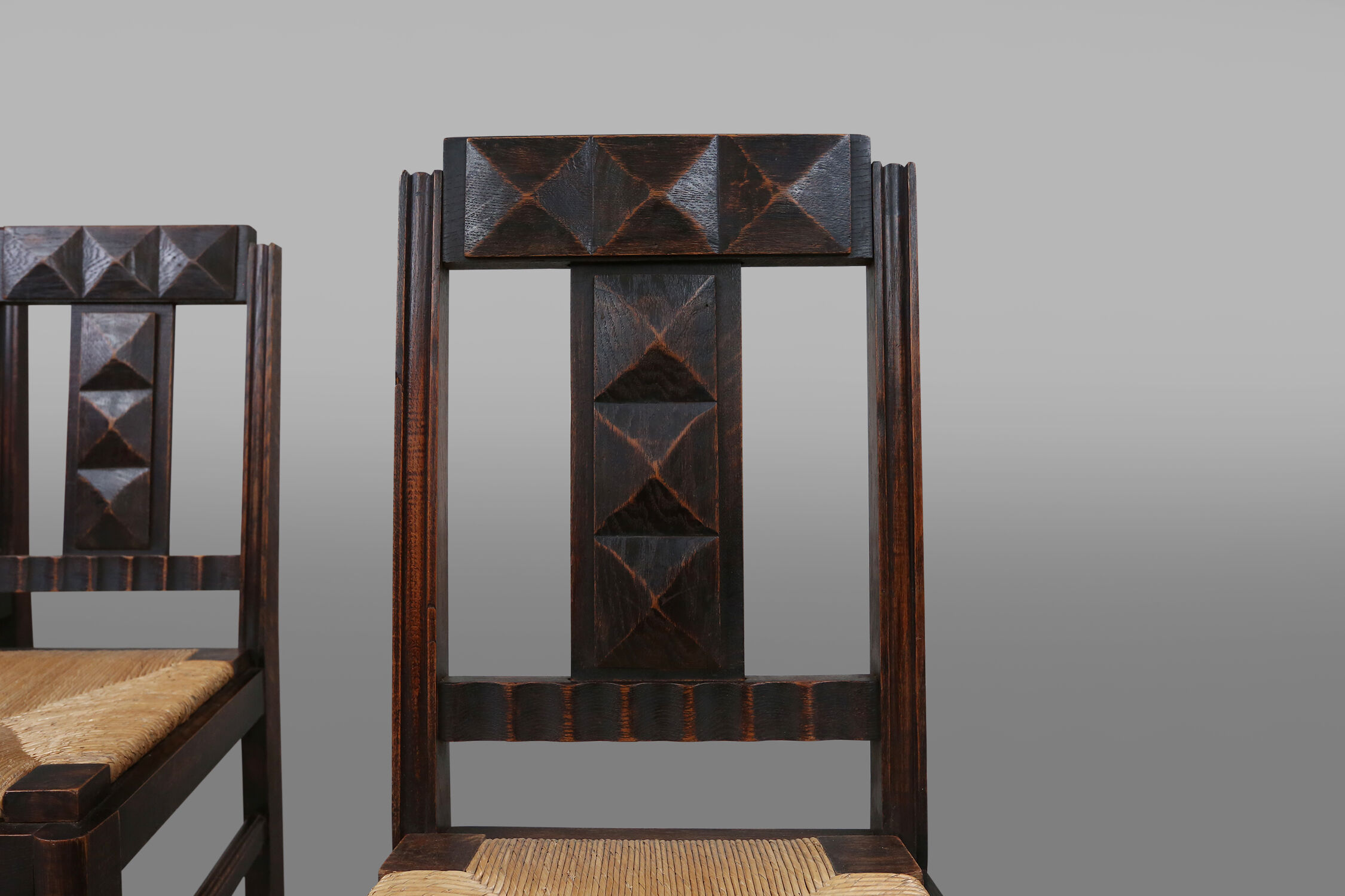 Set of six oak an wicker dining chairs by Victor Courtray