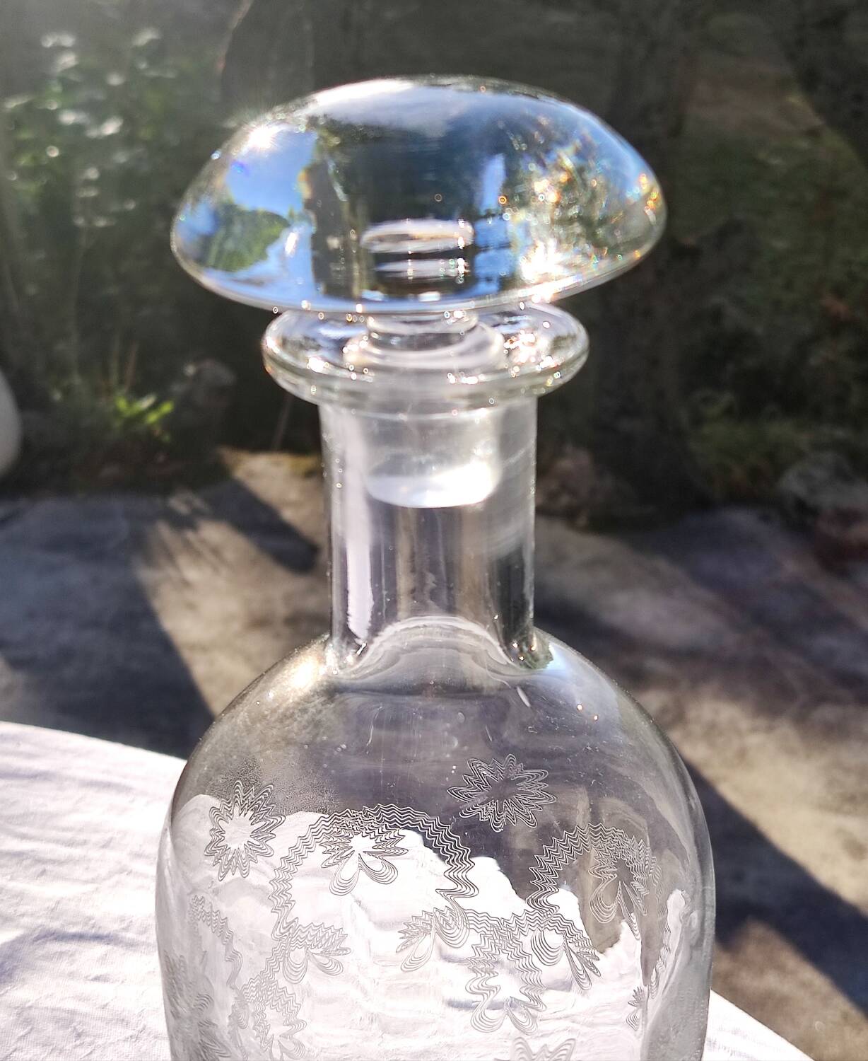 Two antique engraved glass bottles