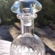 Two antique engraved glass bottles