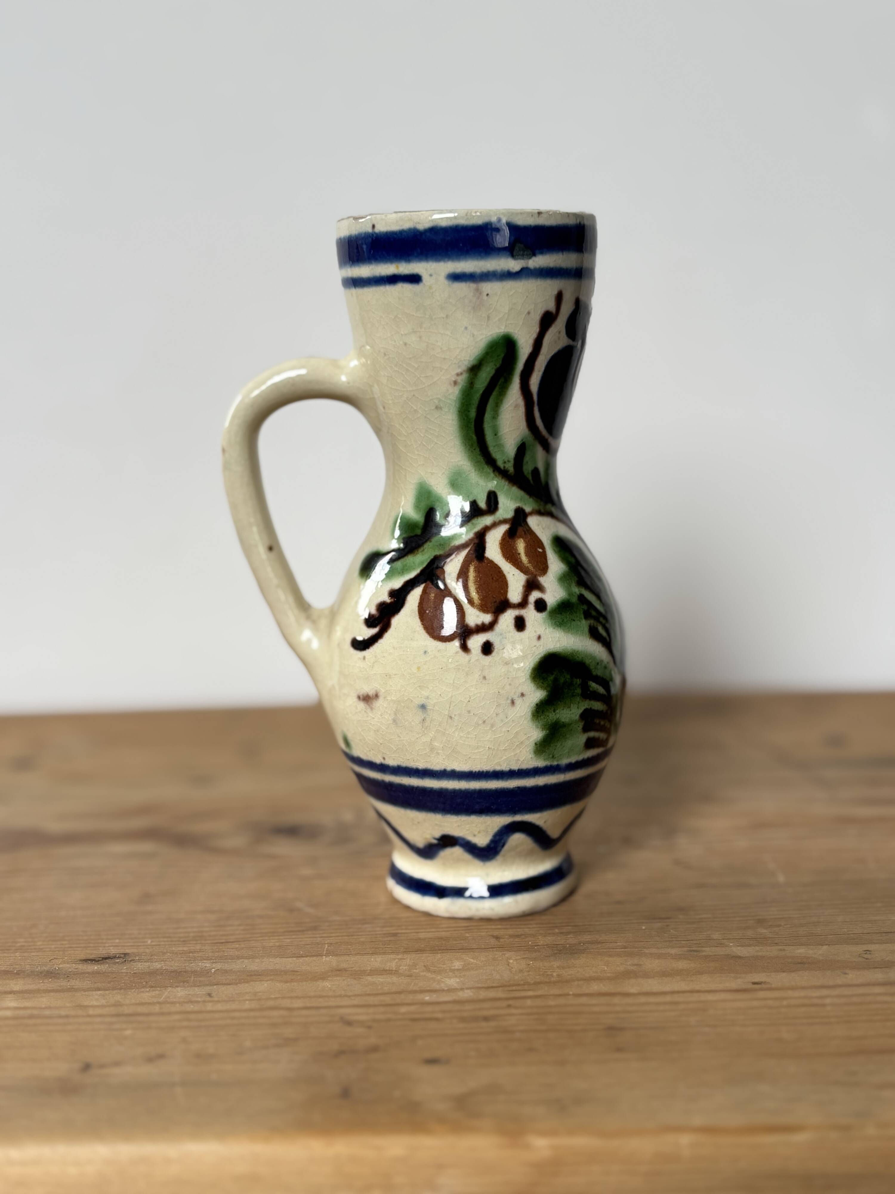 Small Korond style ceramic pitcher with floral motifs
