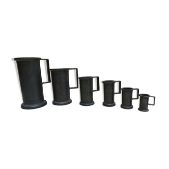 Set of 6 Fleur de Lys pewter measuring pots