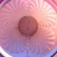 Art deco ball vase in pink opaline enamelled with flowers, 4 shells in relief
