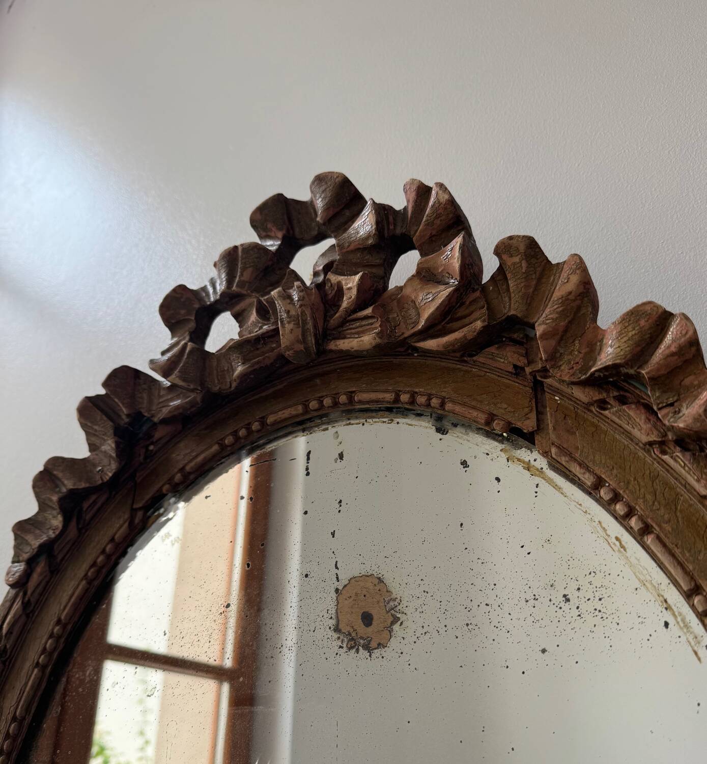 Antique Louis XVI oval knot mirror