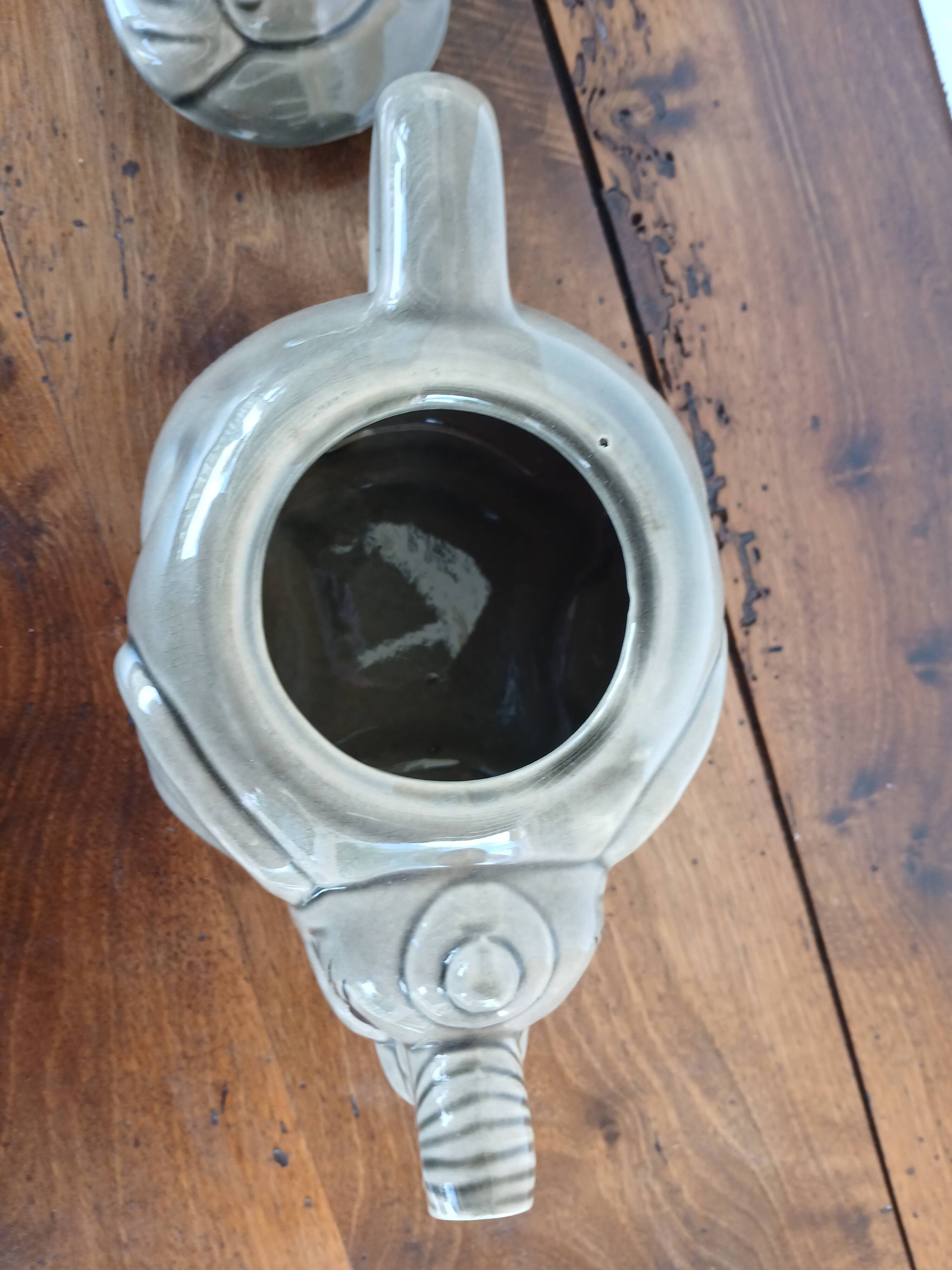 vintage ceramic teapot in the shape of a grey elephant