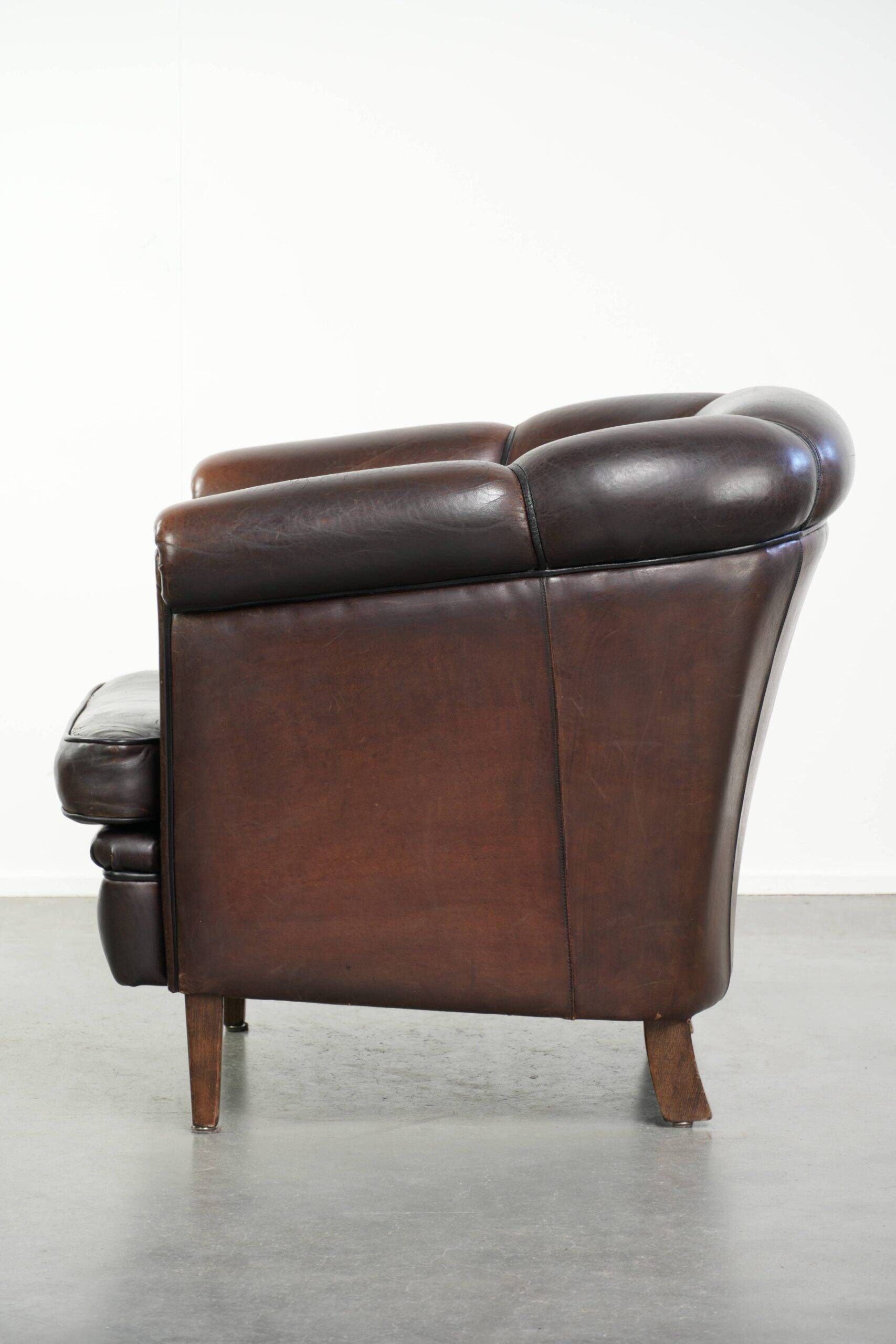 Dark sheepskin club armchair with unique design in English style