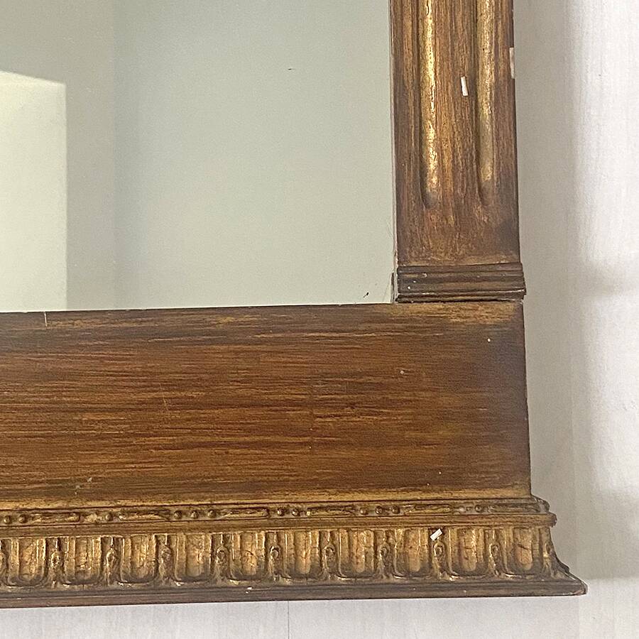 Small golden mirror in Louis XVI style.