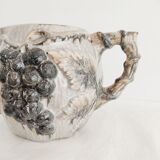 Pitcher bunches of grapes in relief