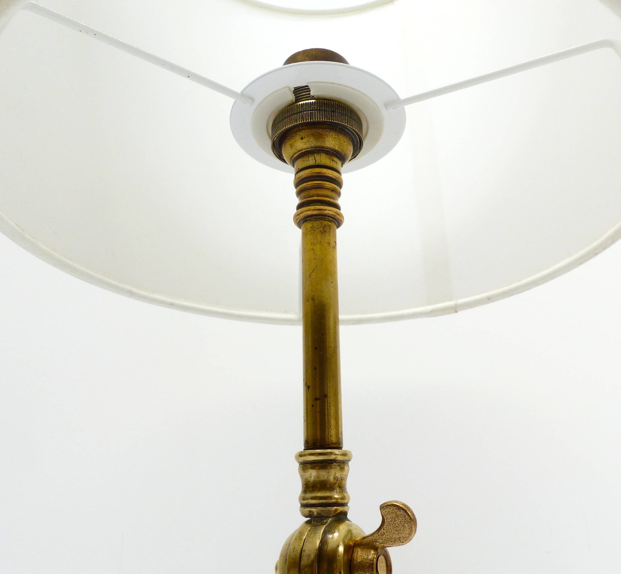 Articulated tripod lamp base in brass, Arts & Crafts style, in the manner of.