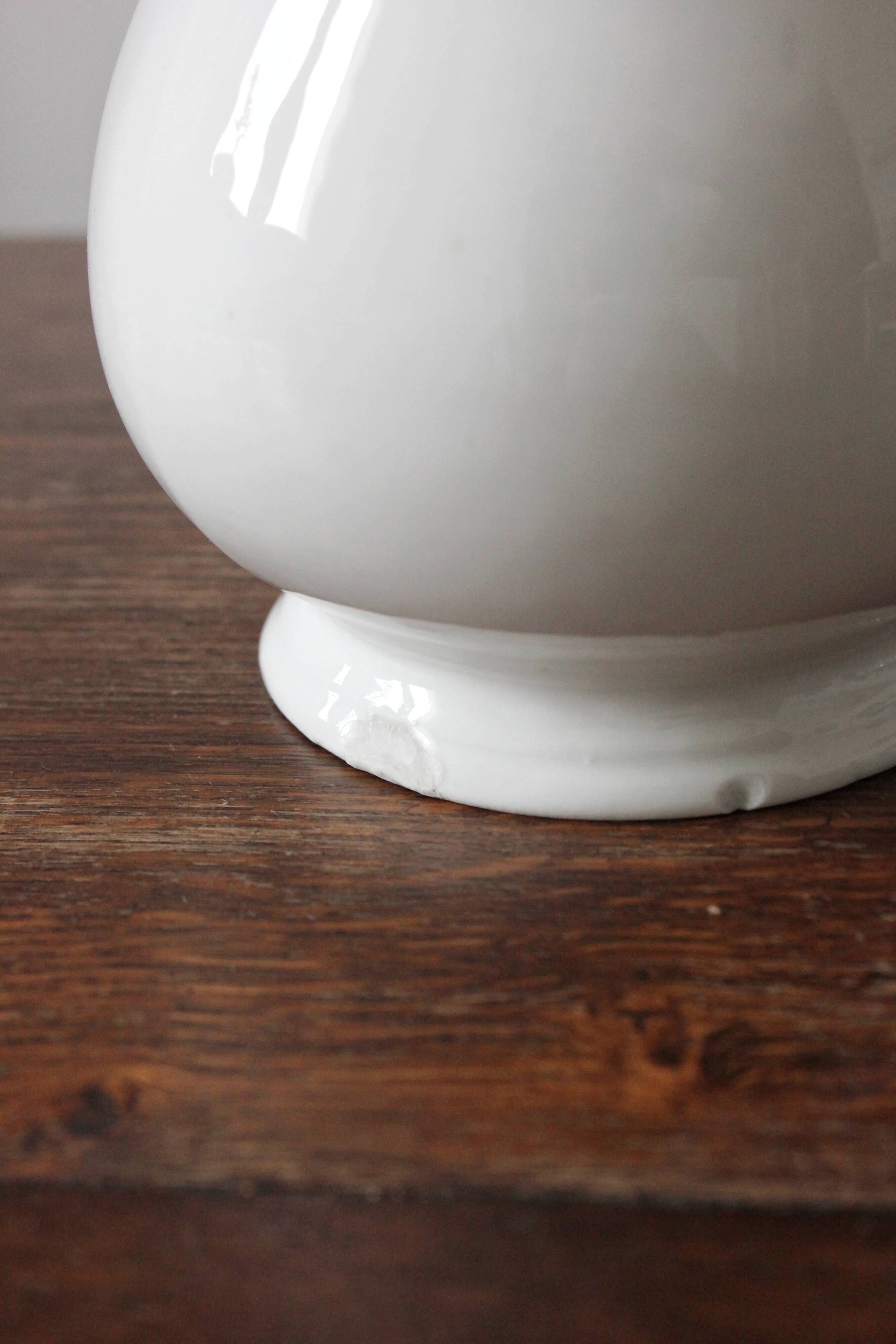 Old broc in white earthenware