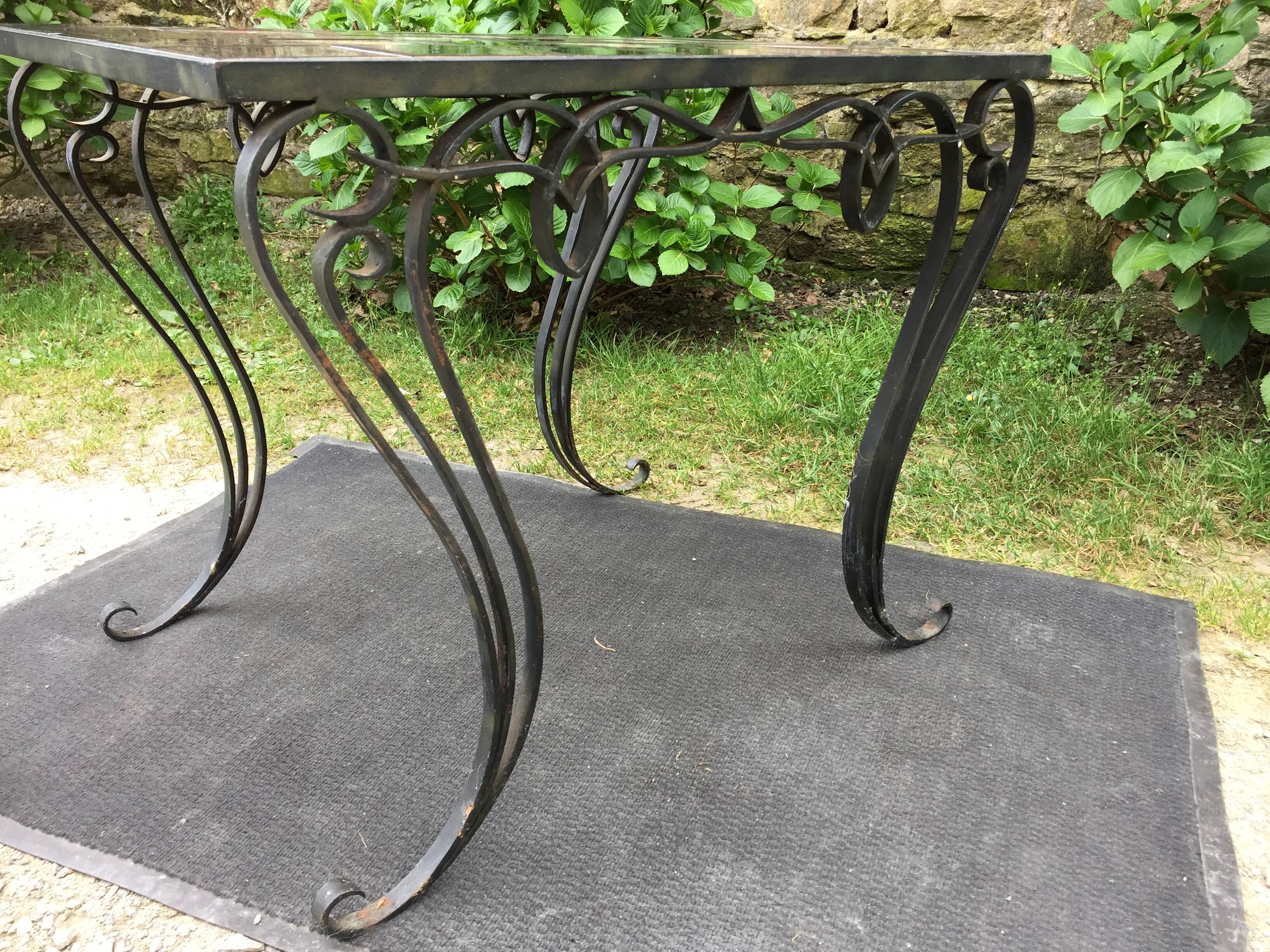 Vintage ceramic coffee table by Guy Trévoux with wrought iron base.