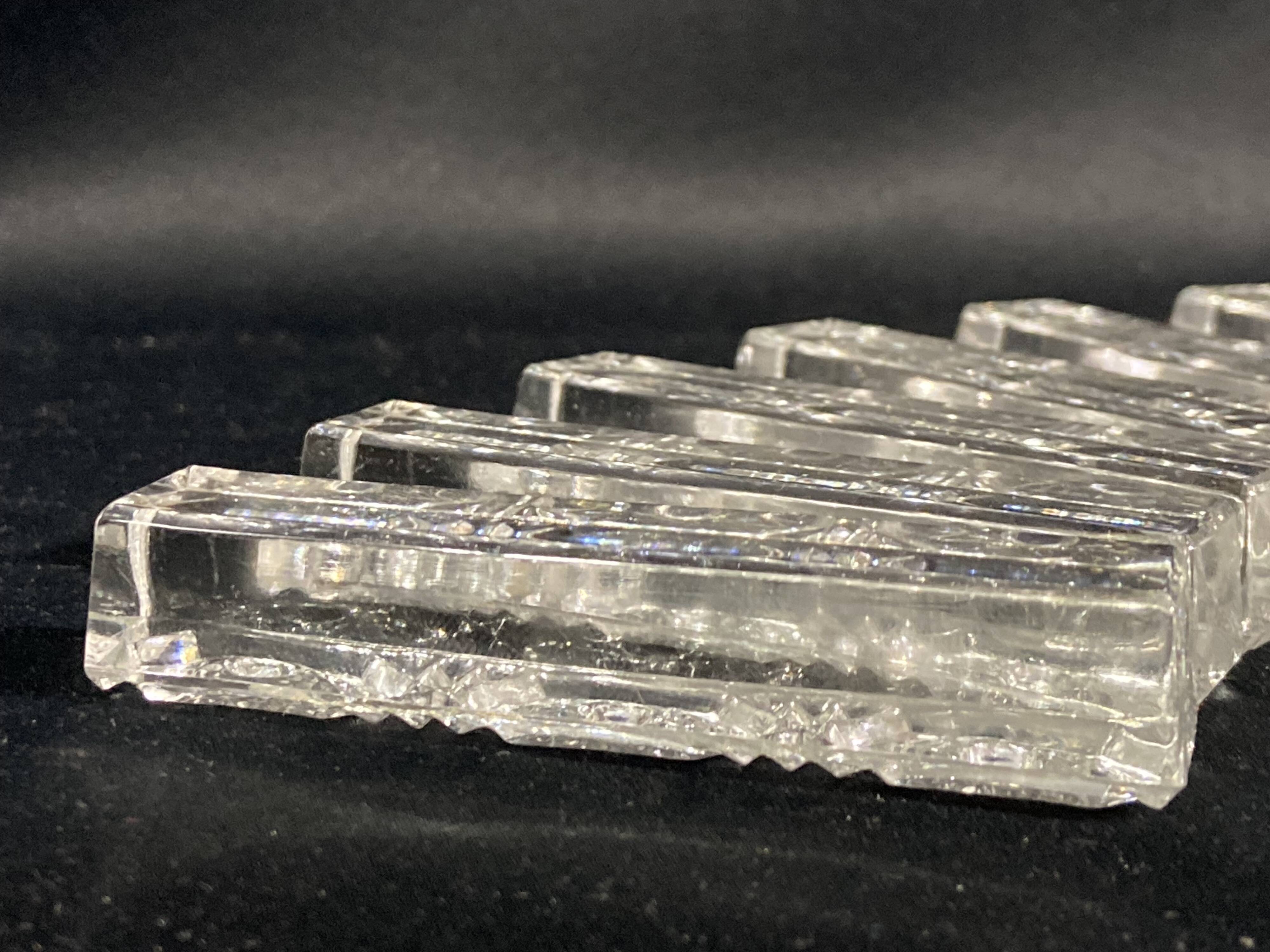Set of 12 molded glass or crystal knife rests with diamond point decor