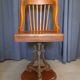 Swivel American chair in walnut and cast iron