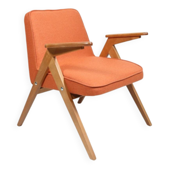 Fauteuil scandinave orange brûlée conclu par Chierowski