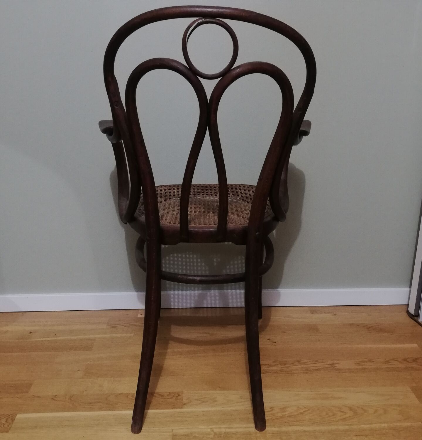 Canned armchair in curved wood signed J.Kohn