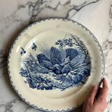 Plat rond en terre de fer à décor d'oiseaux