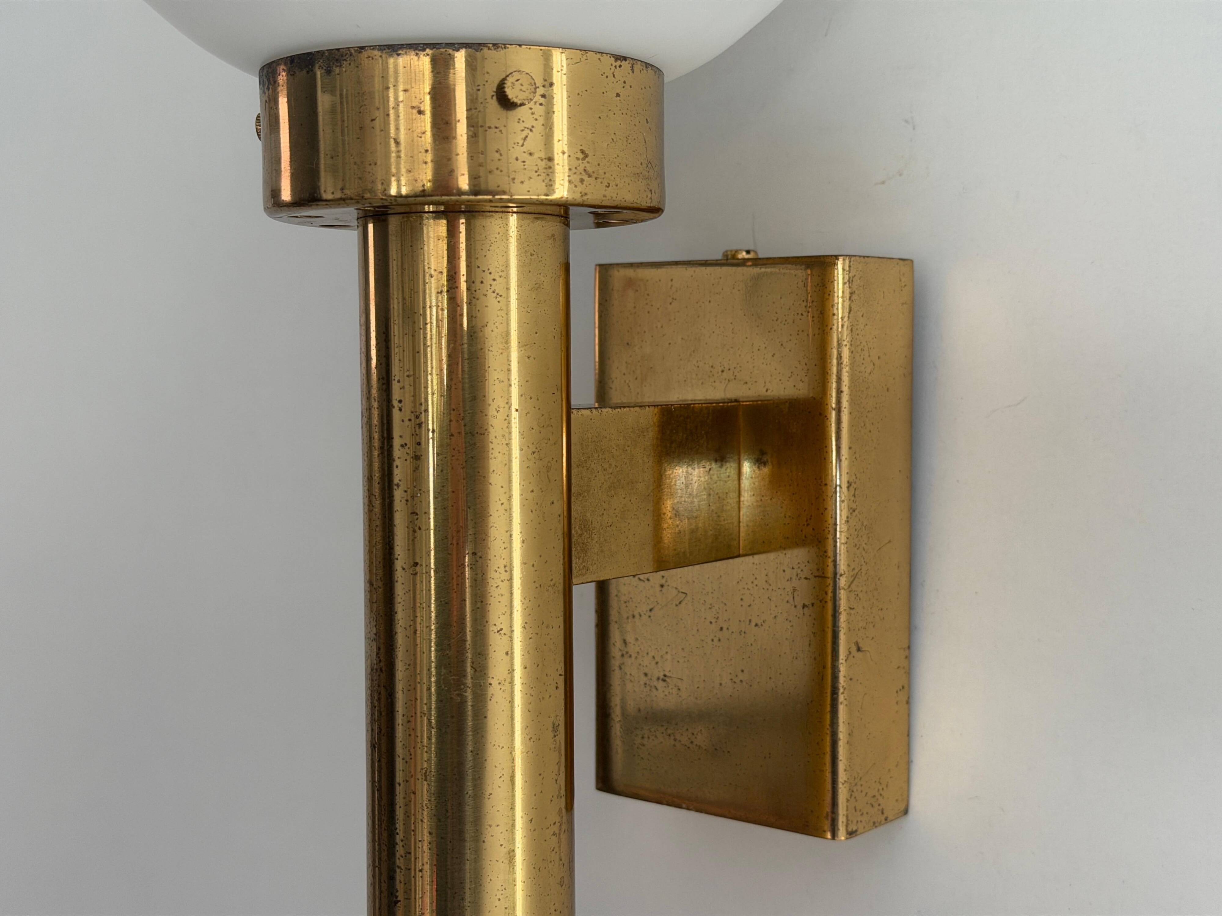 Large minimalist cinema wall light in opal glass and heavy brass, 1960s, Germany