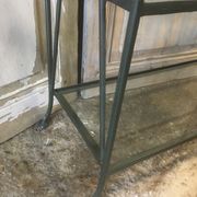Pair of wrought iron and glass bookshelf shelves.