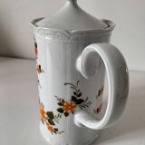 Vintage coffee pot Winterling Bavaria with orange floral decoration.