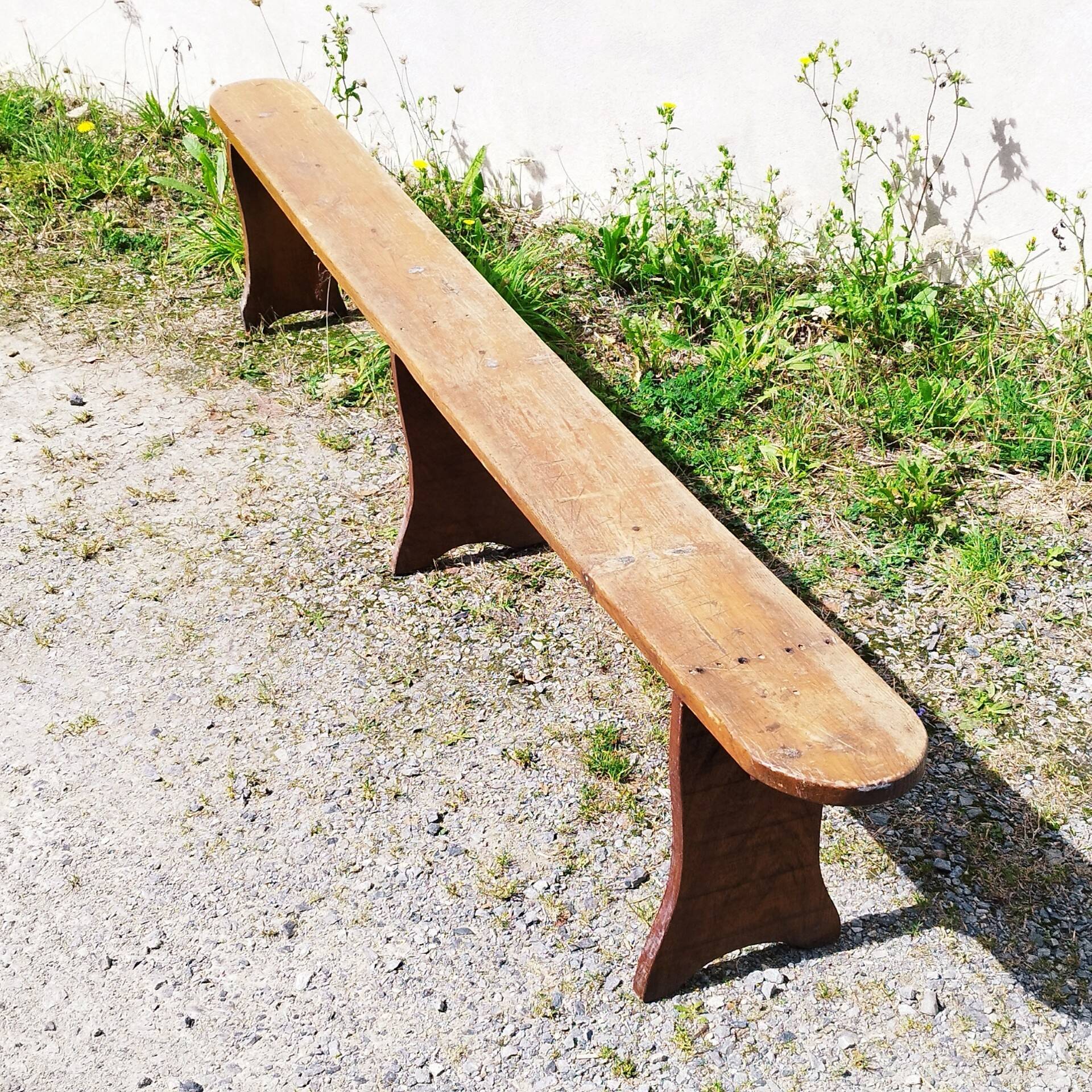 Authentic vintage farmhouse bench in varnished wood