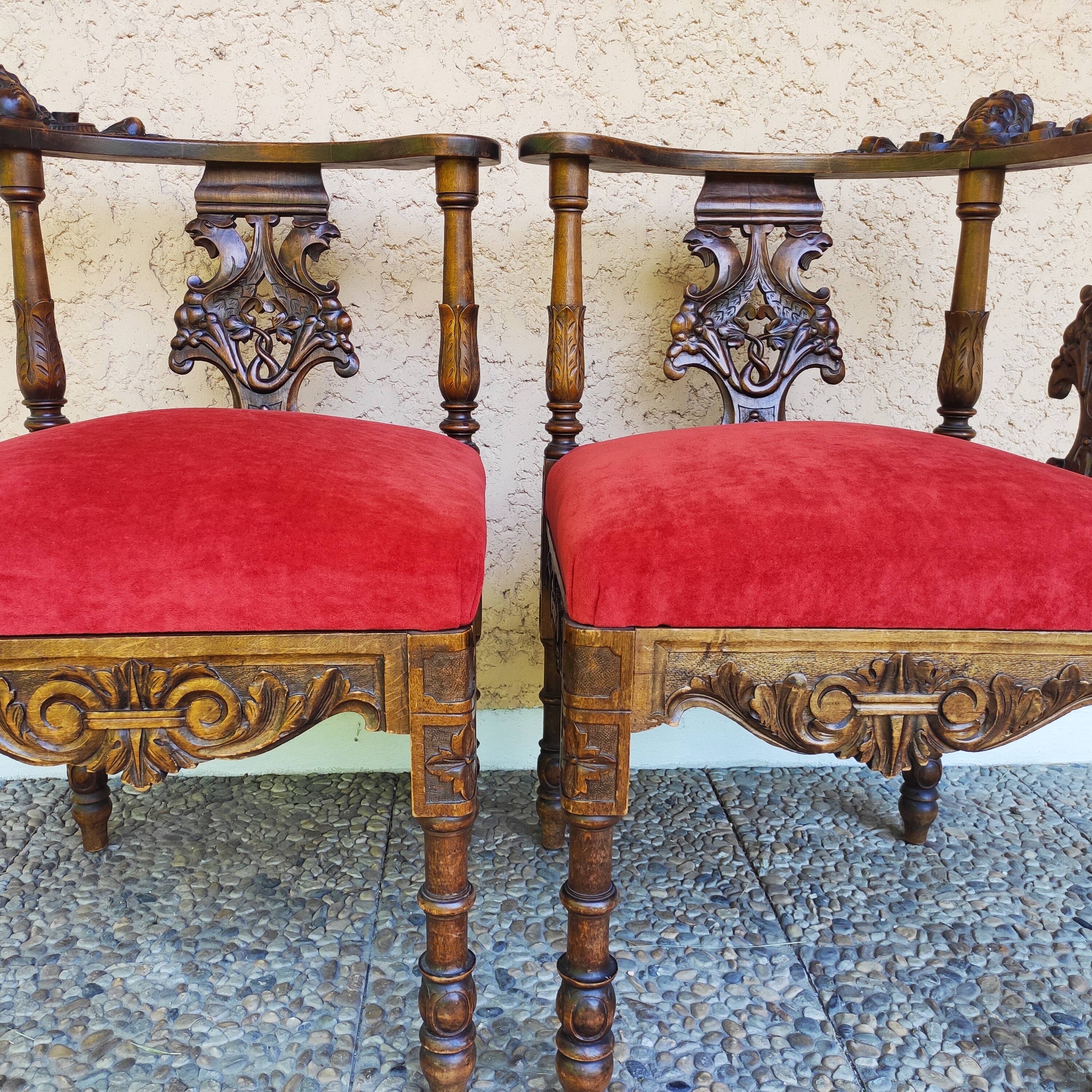 Pair of neo-Renaissance Henri II corner armchairs in carved wood, 19th century.