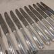 12 silver-plated table knives by Christofle America, 24.5cm