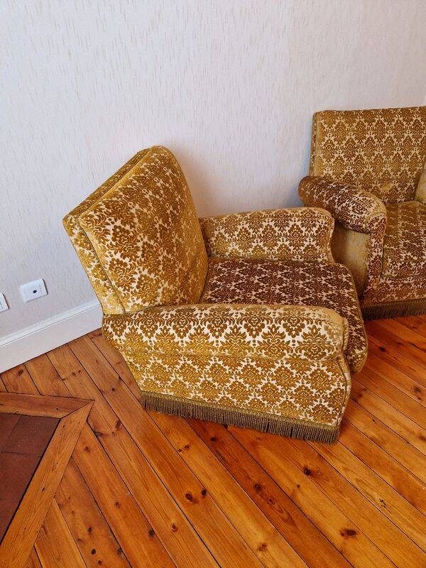 Pair of golden fringed armchairs
