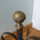 Chenets tête boule bronze doré
