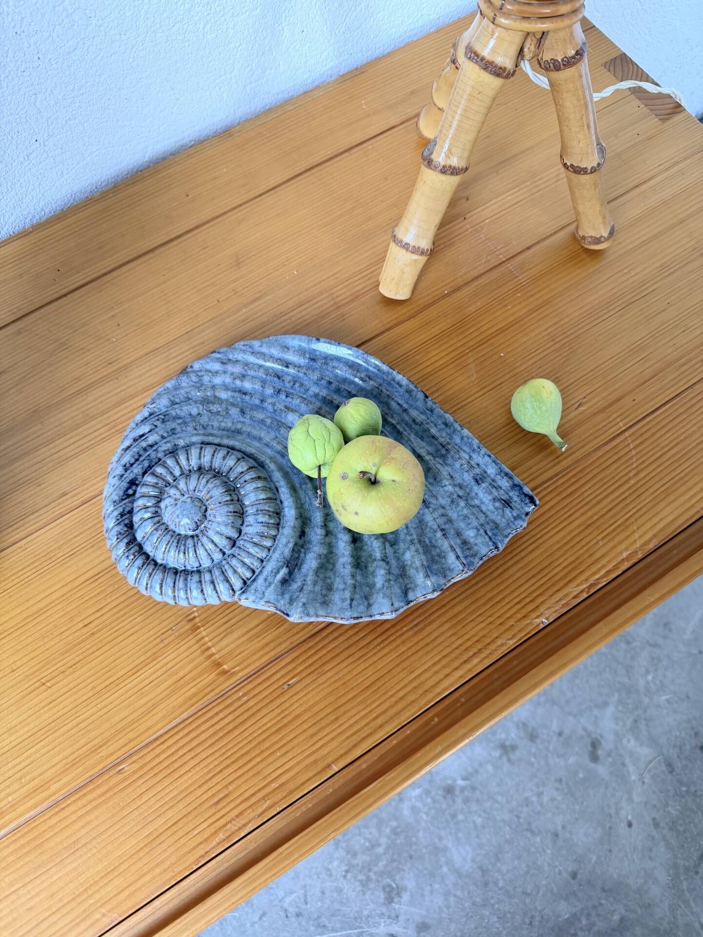 Shell-shaped ceramic catchall.