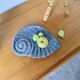 Shell-shaped ceramic catchall.