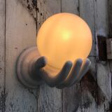 Hand-shaped ceramic wall light