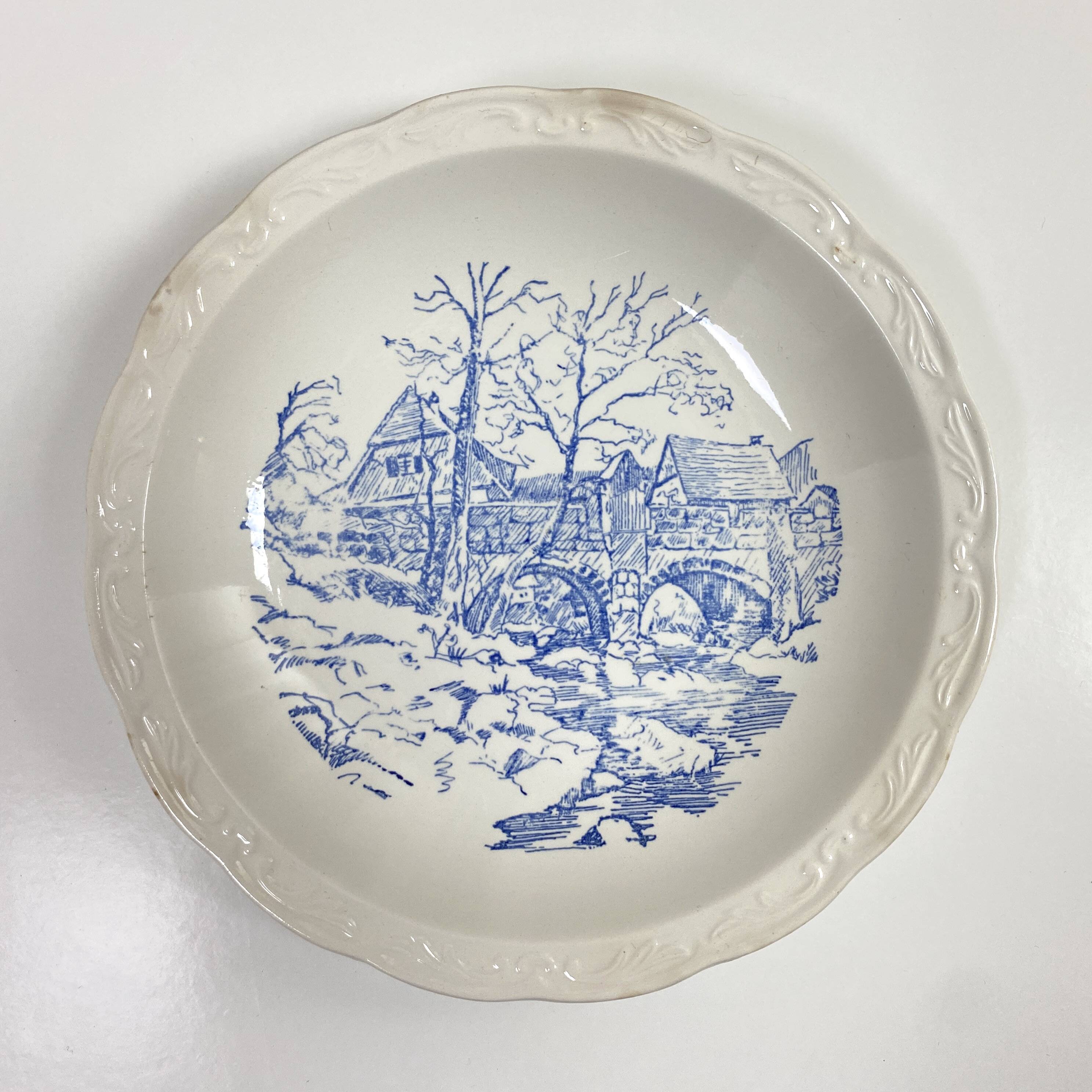 Set of two matching soup plates, one plain and one decorated