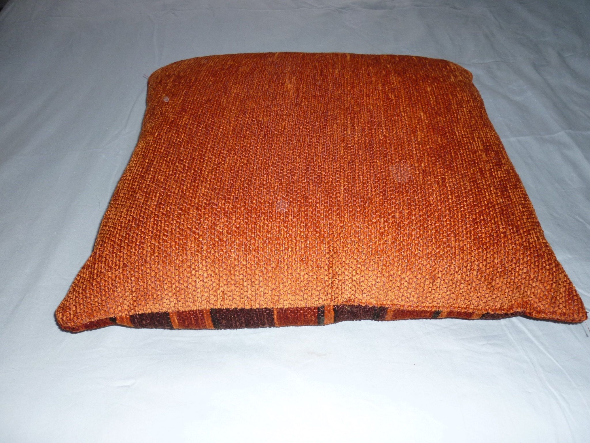 Large orange velvet cushion