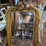 Golden mirror with a flute-playing angel