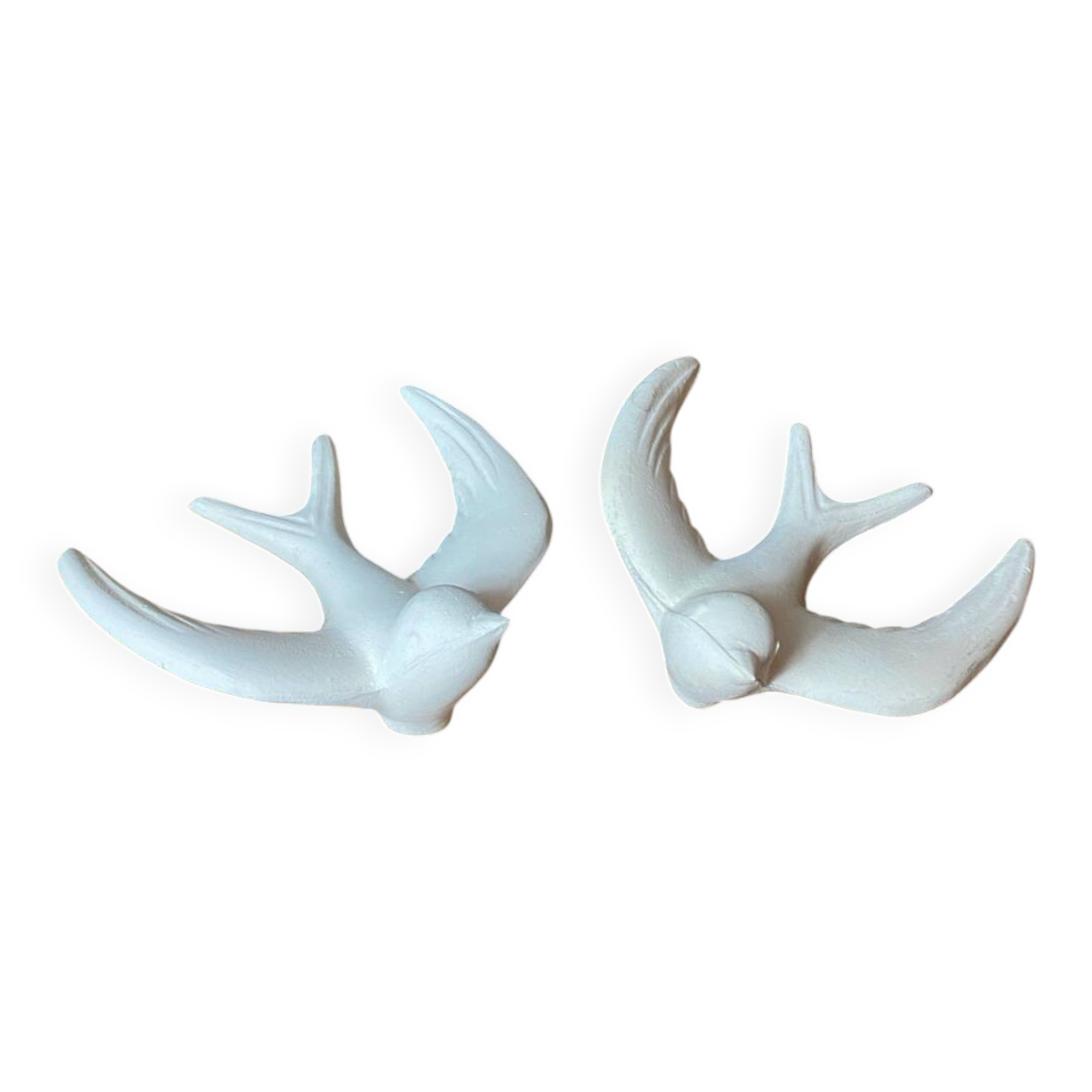 Pair of plaster swallows